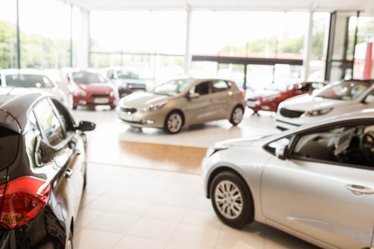 Modern car showroom with multiple vehicles on display